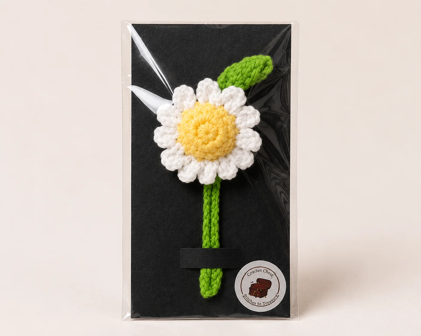 Handmade crochet daisy bookmark with braided stem and floral page marker