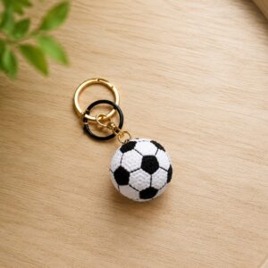 Handmade crochet football keychain with mini soccer ball amigurumi charm