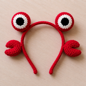 Handmade crochet crab headband featuring cute sea creature inspired hair accessory