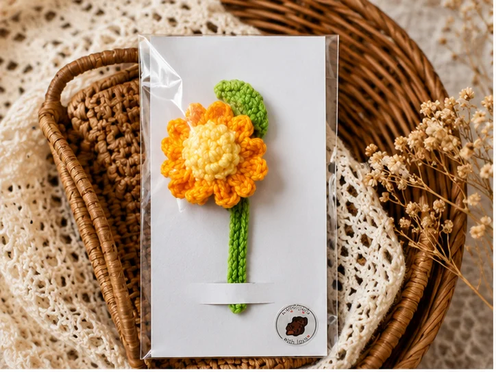 Handmade crochet marigold bookmark with colorful floral design and green leaf - Image 2